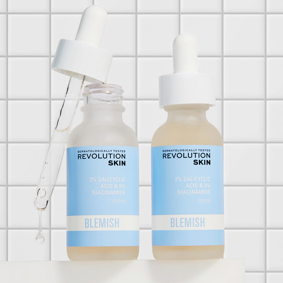 An image of Revolution Skincare 2% Salicylic Acid BHA Anti Blemish Liquid Exfoliant Toner against a bathroom tile background